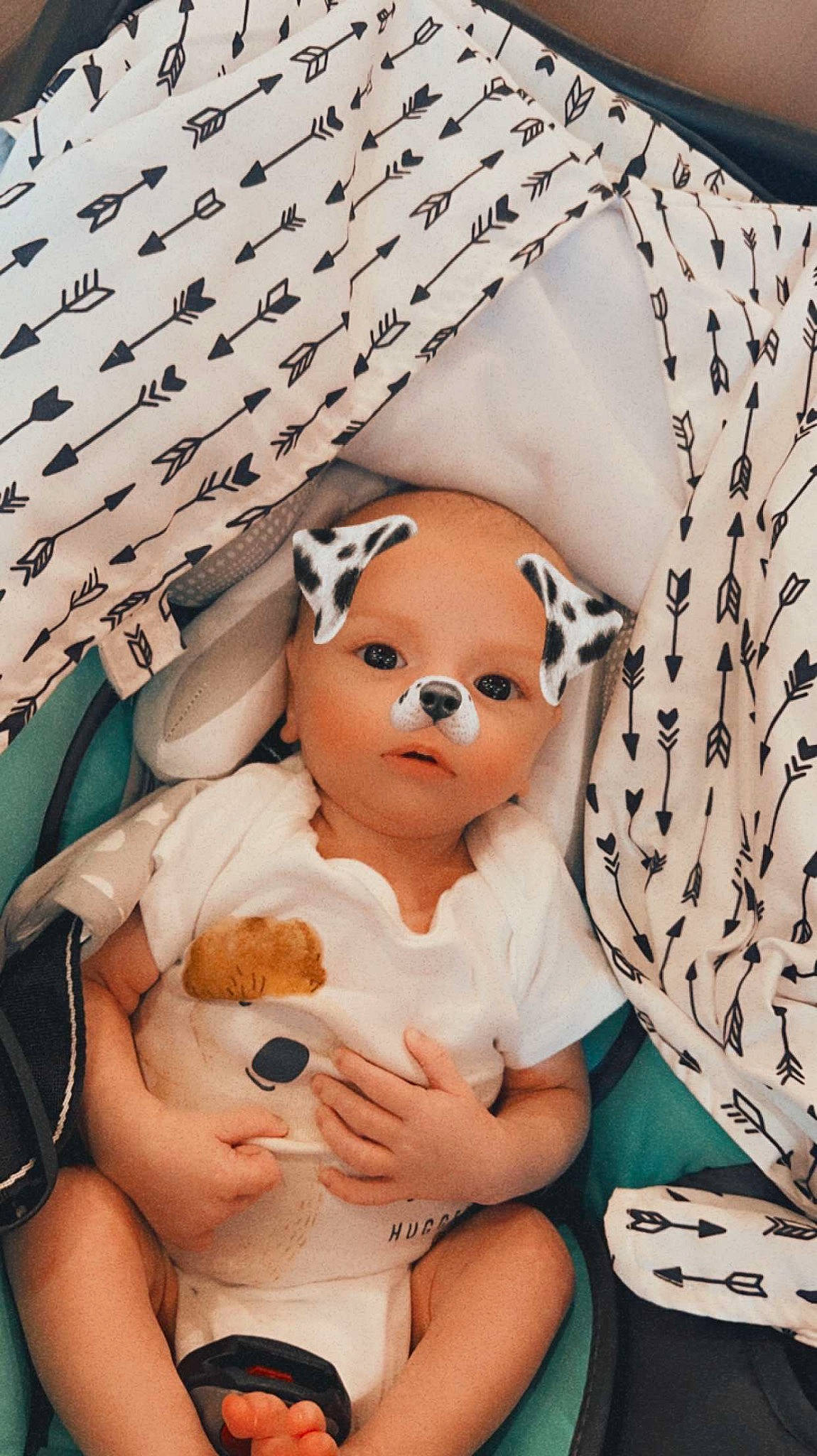 Travis is registered to the contest to win money with this photo: abdomen, baby, baby_sleeping, chest, child, comfort, doll, eyelash, fawn, foot, fur, linens, pattern, person, room, sleeve, stuffed_toy, textile, toy, trunk