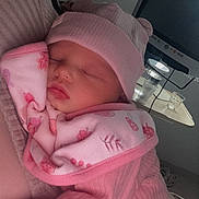 Pheobe joined the competition — help win amazing prizes! baby, blanket, closeup, comfort, cozy, cute, face, glass, hand, hat, indoor, infant, monitor, newborn, person, pink_clothing, resting, sleeping, soft_light, table