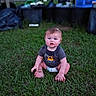 Kayson is registered to the contest to win money with this photo: baby, child, infant, sitting, grass, outdoor, backyard, portrait, face, blue_eyes, brown_hair, smiling, surprised, clothing, diaper, t_shirt, construction_graphic, lawn, garden, wooden_fence
