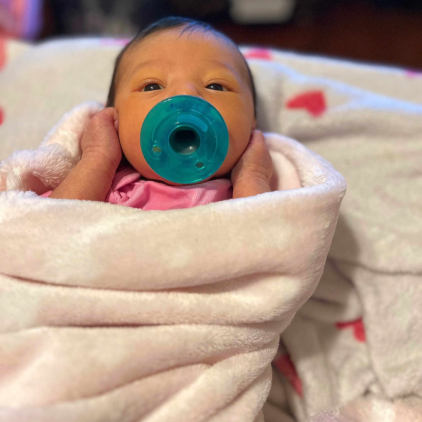 Rosalynn is registered to the contest to win money with this photo: baby, newborn, pacifier, blanket, pink, wrapped, infant, face, sleepy, indoors, soft, cute, child, person, hands, cozy, portrait, young, warm, resting