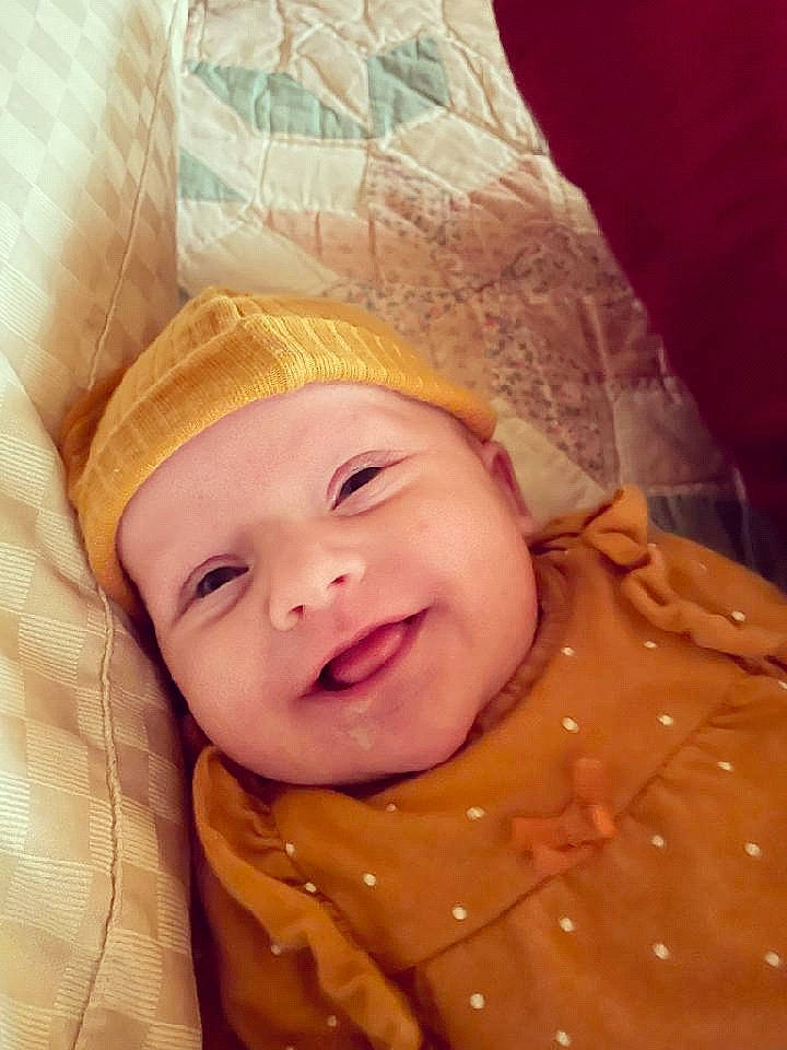 Santanna is registered to the contest to win money with this photo: baby, baby_laughing, baby_products, baby_toddler_clothing, cheek, comfort, eye, fashion_accessory, fun, happy, head, headwear, iris, joy, laugh, linens, lip, nose, person, skin