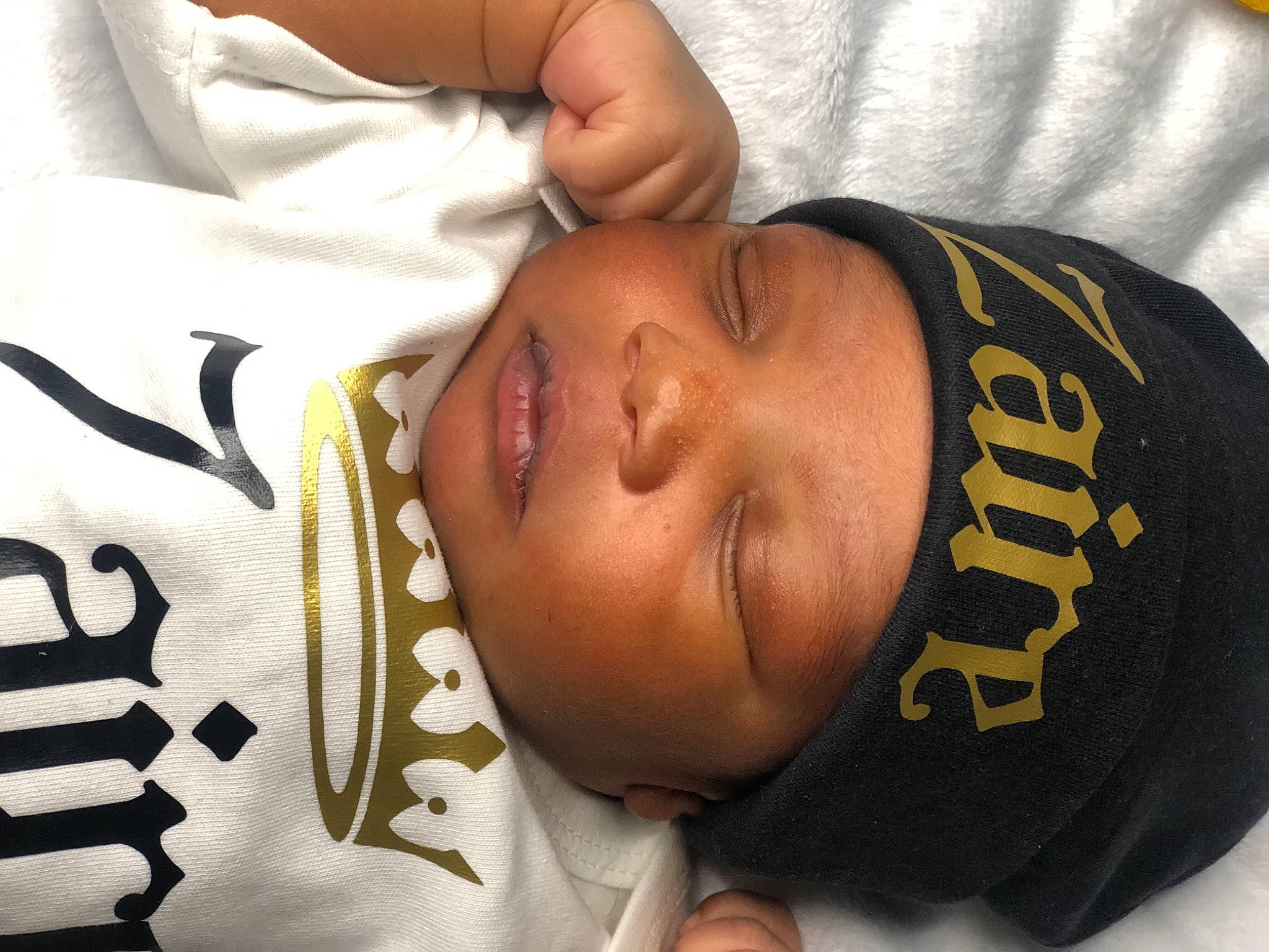 Zaire is registered to the contest to win money with this photo: abdomen, cheek, chest, comfort, ear, elbow, eye, eyelash, finger, forehead, gesture, hair, head, headwear, human_body, neck, nose, person, skin, toddler