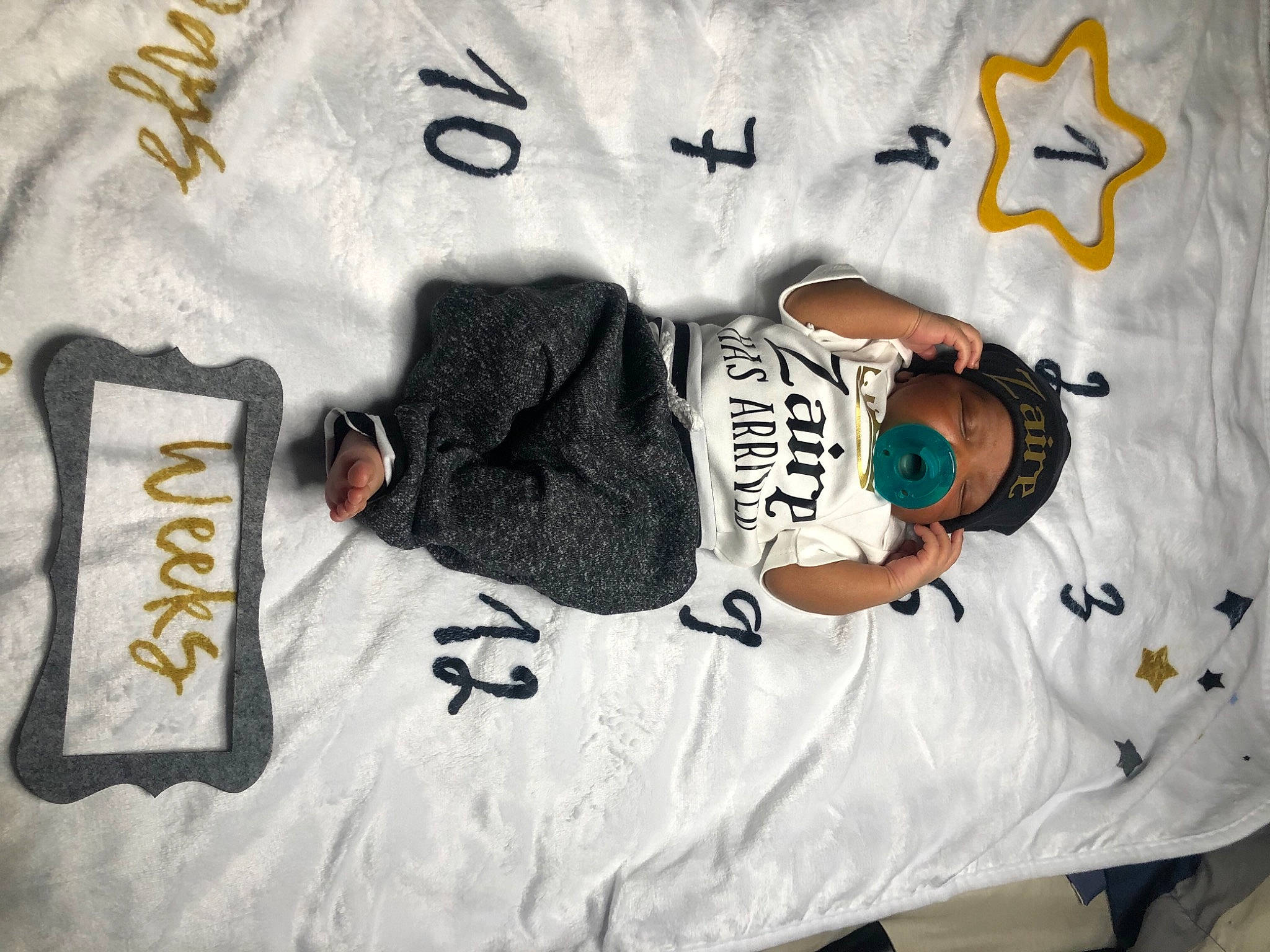 Zaire joined the competition — help win amazing prizes! brand, cool, elbow, font, graphics, grey, hat, headwear, jersey, linens, logo, number, outerwear, pattern, person, room, sleeve, sportswear, t_shirt, top