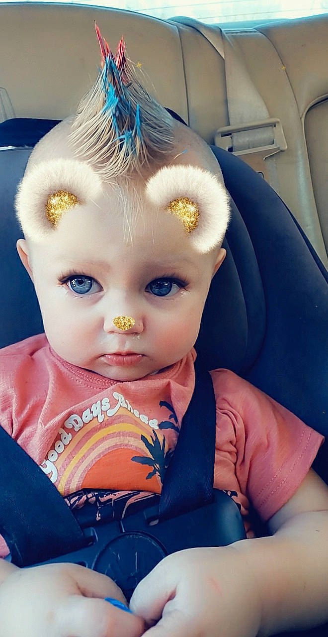 Greyson is registered to the contest to win money with this photo: baby_toddler_clothing, blue, cheek, chin, doll, dress, eye, eyebrow, eyelash, hair, head, human_body, iris, lip, mouth, neck, nose, person, skin, toy