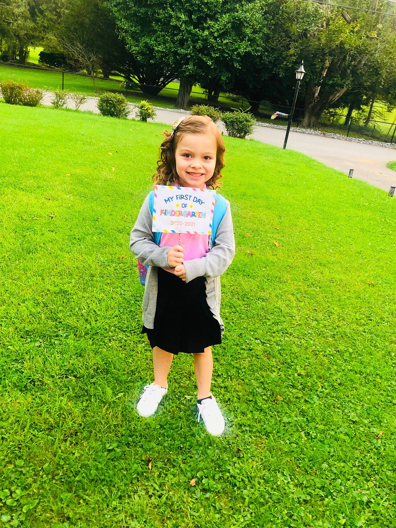 Khloee is registered to the contest to win money with this photo: baby_toddler_clothing, fun, grass, grass_family, grassland, green, happy, joy, leisure, meadow, natural_environment, people_in_nature, person, plant, recreation, shorts, sleeve, smile, summer, t_shirt