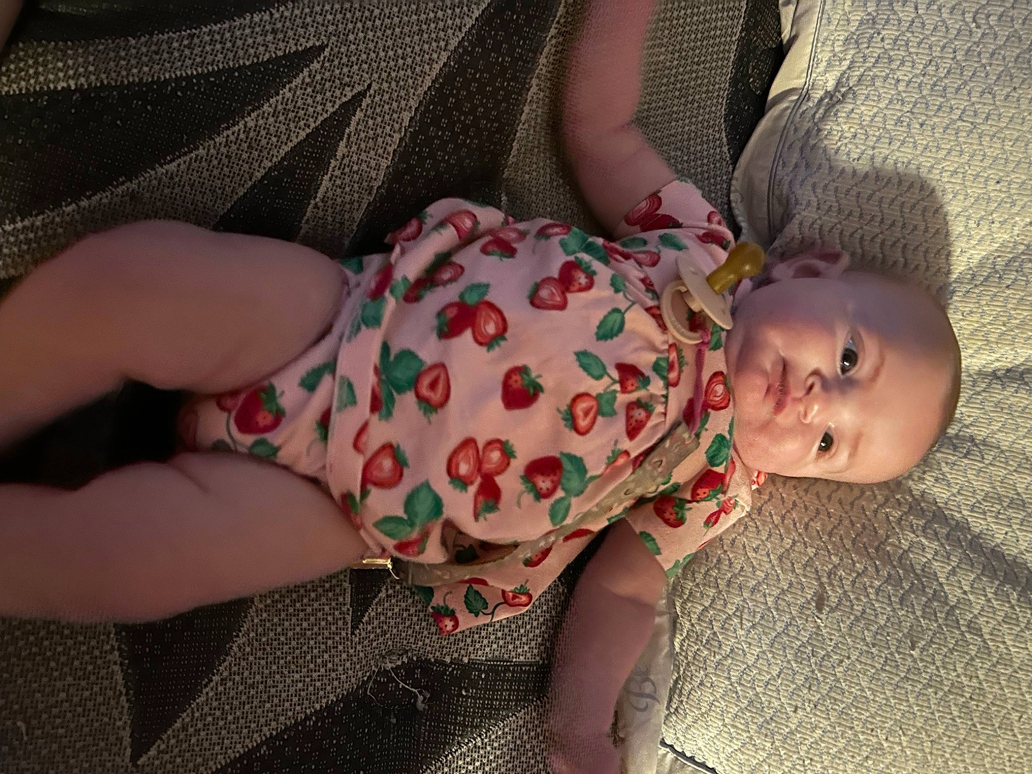 Willow is registered to the contest to win money with this photo: baby, baby_toddler_clothing, cheek, child, comfort, finger, grass, hand, human_body, iris, linens, lip, mouth, nail, pattern, person, pink, skin, sleeve, toddler