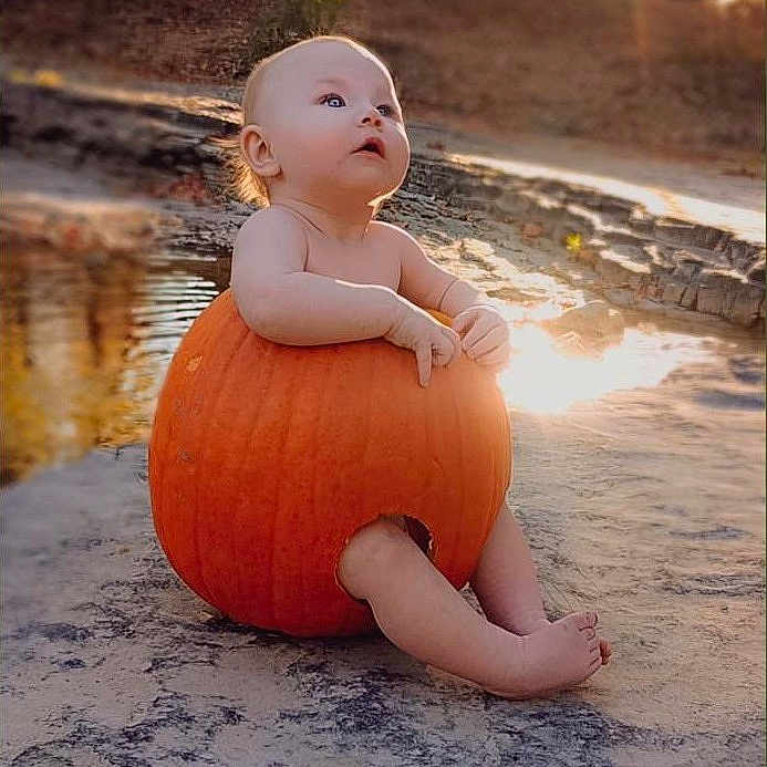 Willow joined the competition — help win amazing prizes! baby, clothing, face, festival, food, halloween, happy, head, person, photography, plant, portrait, produce, pumpkin, sitting, sleeve, squash, vegetable