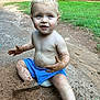 toddler, child, dirt, mud, blue_shorts, bare_chest, outdoor, grass, gravel_path, play, happy, messy, nature, barefoot, summer, expression, sitting, daylight, cute, curly_hair