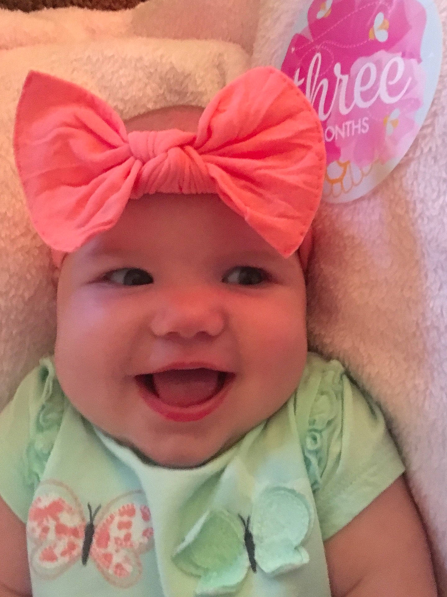 Mia is registered to the contest to win money with this photo: cap, cheek, child, ear, fashion_accessory, forehead, hair_accessory, head, headband, headgear, infant, laughter, lip, person, pink, product, skin, smile, toddler