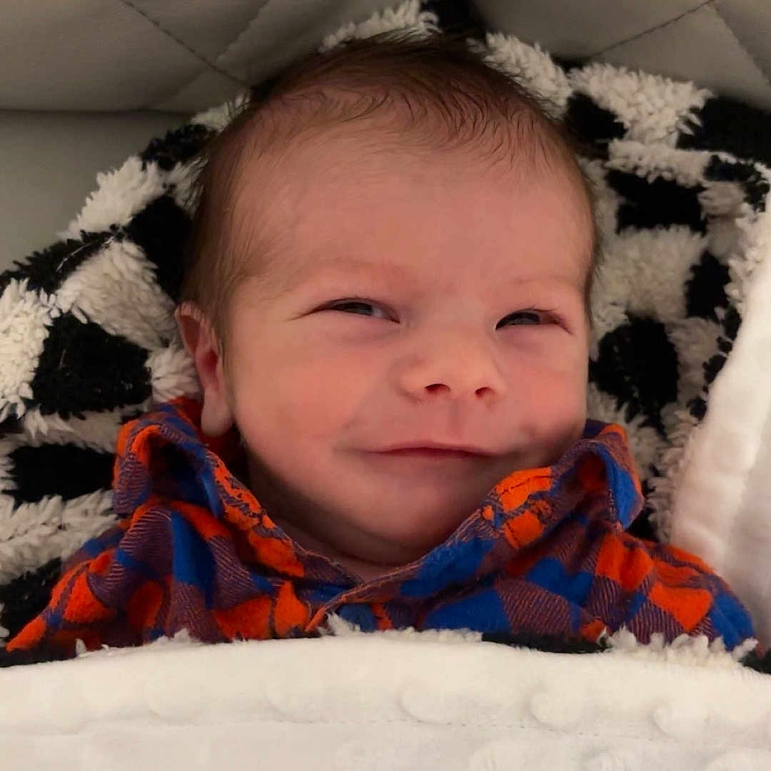 Bowman joined the competition — help win amazing prizes! baby, bed, blanket, clothing, coat, cushion, face, furniture, happy, hat, head, homedecor, jacket, newborn, person, photography, portrait, quilt, scarf, sleeping