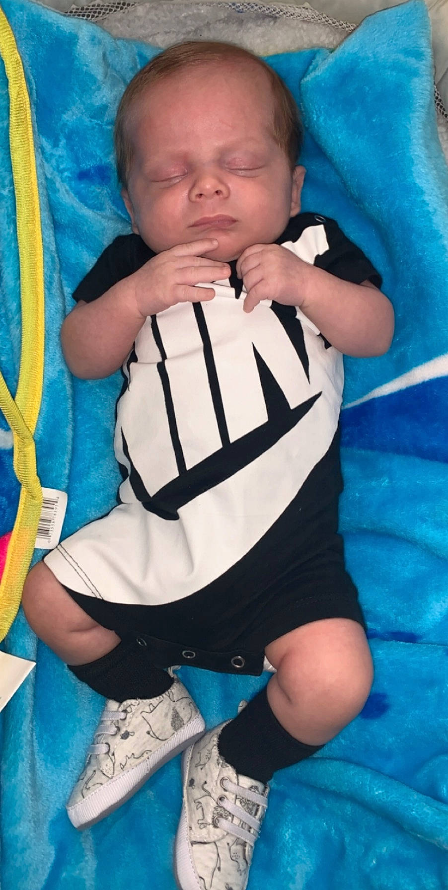 Boston is registered to the contest to win money with this photo: arm, baby, baby_products, cheek, child, finger, knee, leg, person, product, sitting, thigh, thumb, toddler, turquoise