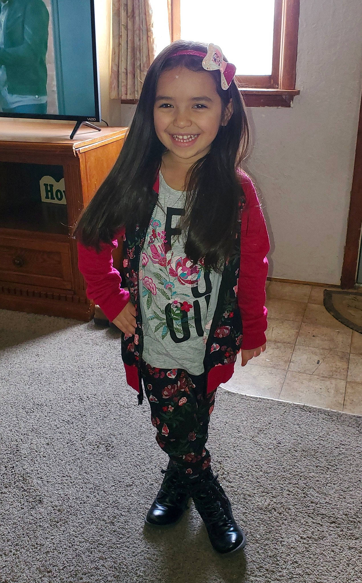 Jazmin is registered to the contest to win money with this photo: black_hair, boot, child, child_model, clothing, footwear, joy, knee, leg, leggings, long_hair, outerwear, person, riding_boot, shoe, snapshot, t_shirt, thigh, tights