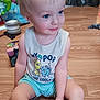 toddler, child, sitting, blue_eyes, blonde_hair, tank_top, shorts, indoor, wooden_floor, toys, smiling, cute, playful, person, young_child, floor, casual_clothing, happy, home, daylight