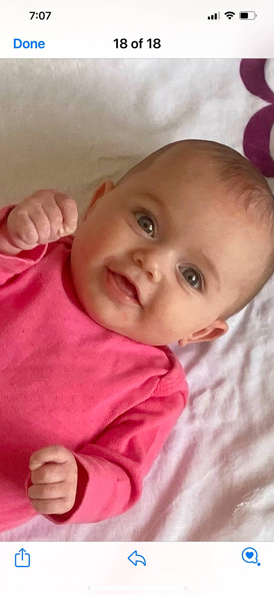 Esme is registered to the contest to win money with this photo: baby, baby_toddler_clothing, cheek, chin, comfort, eye, eyebrow, finger, gesture, happy, iris, lip, mouth, nose, person, pink, product, skin, sleeve, smile