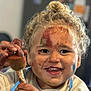 Ezekiel a rejoint le concours — aidez-le/la à gagner de superbes lots ! child, toddler, paint, messy, smiling, face_paint, curly_hair, blonde, holding_object, art, creative, happy, indoor, apron, closeup, expression, person, fun, paintbrush, play