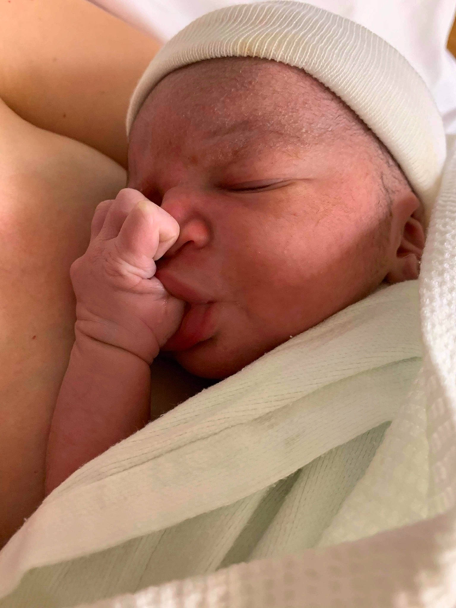 Dakari is registered to the contest to win money with this photo: baby, baby_products, baby_sleeping, bedtime, cheek, child, childbirth, comfort, finger, gesture, hand, human_body, linens, mouth, nail, neck, nose, person, skin, thumb