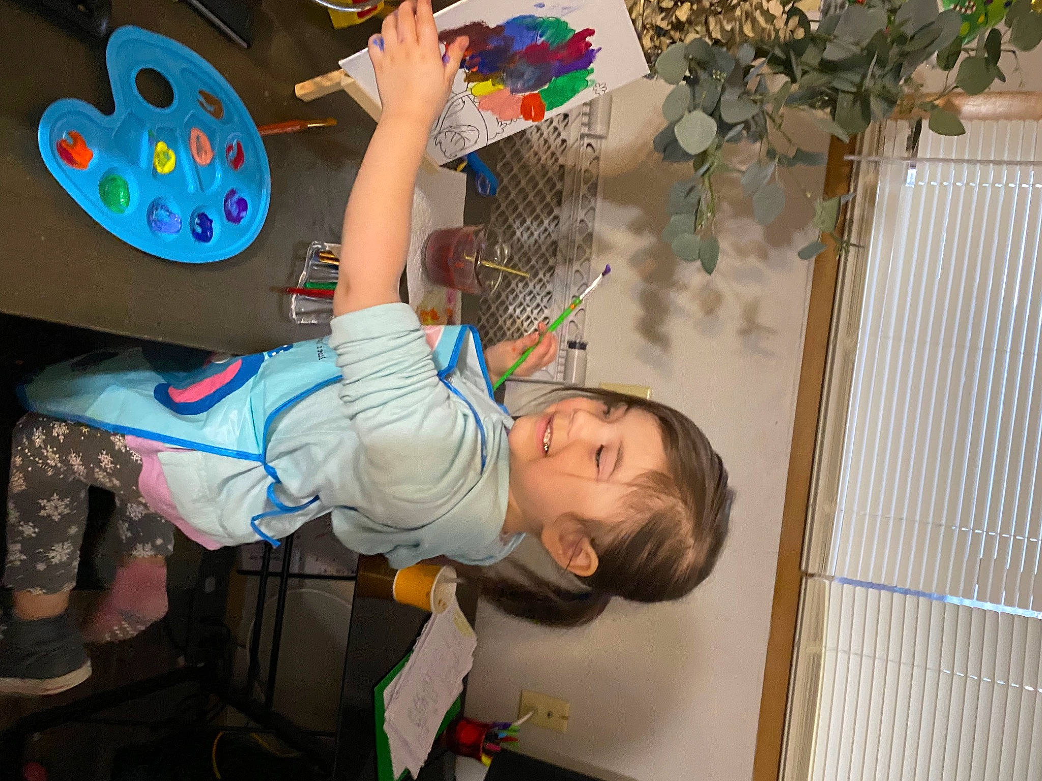 Veda is registered to the contest to win money with this photo: artist, baby, baby_products, child, fun, happy, joy, leisure, mural, party_supply, person, plant, play, recreation, room, sandal, shorts, t_shirt, toddler, tree