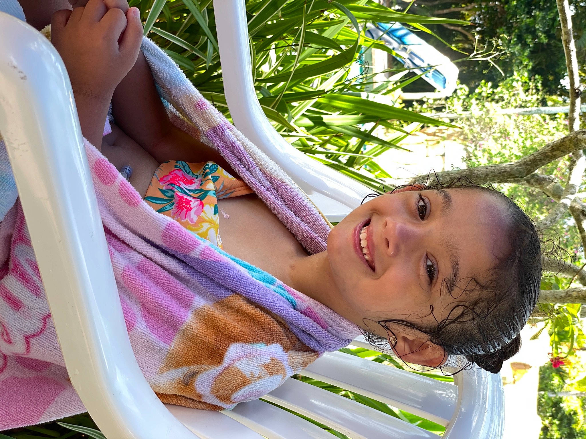 Aramya is registered to the contest to win money with this photo: beauty, black_hair, elbow, fun, grass, happy, human_leg, joy, leisure, magenta, people_in_nature, person, photograph, recreation, sitting, skin, smile, thigh, throat, toddler