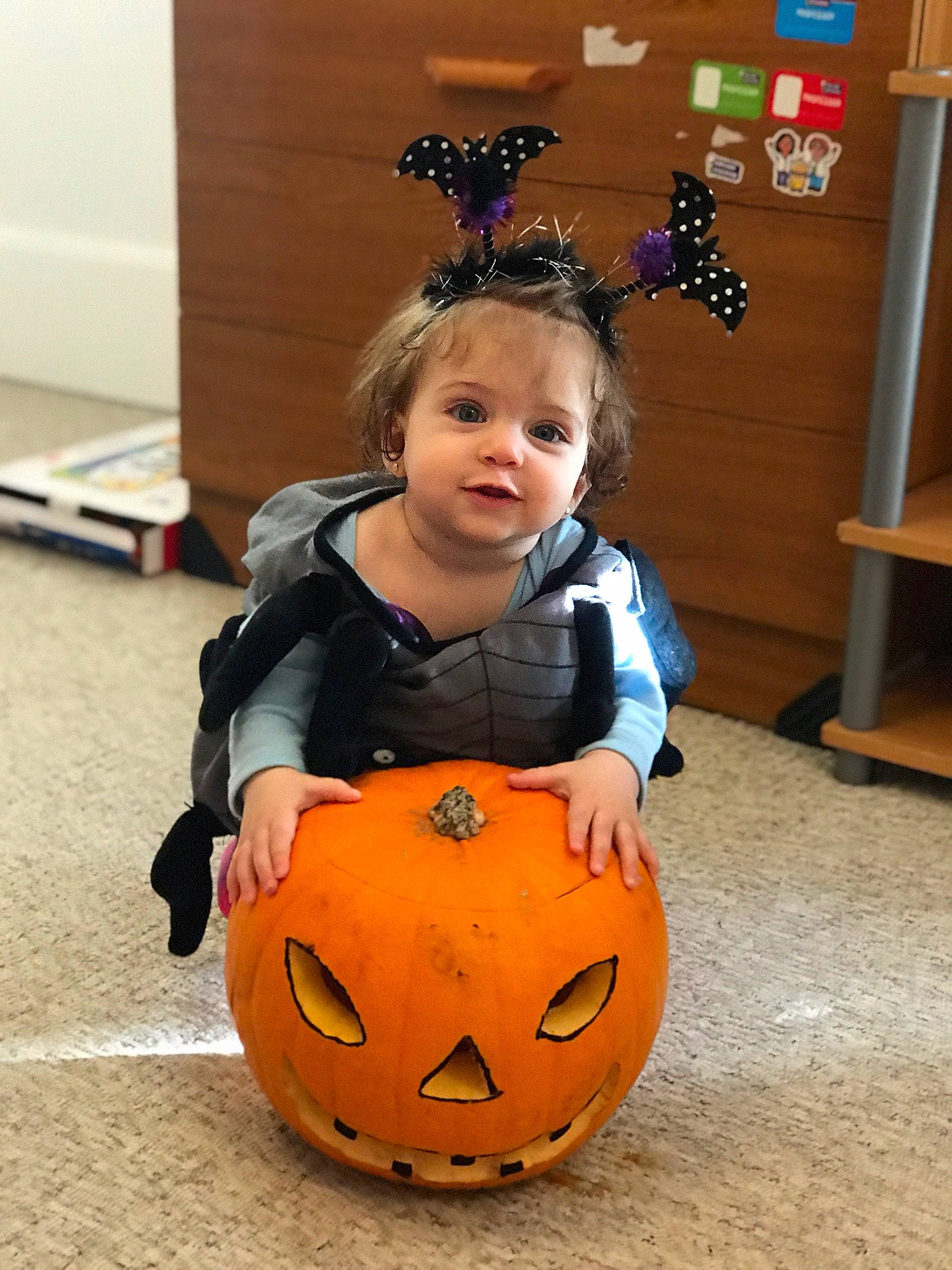 Erika is registered to the contest to win money with this photo: art, calabaza, cucurbita, eye, face, flooring, fun, gourd, happy, head, human_body, jack_o_lantern, orange, person, plant, pumpkin, squash, toddler, trick_or_treat, vegetable