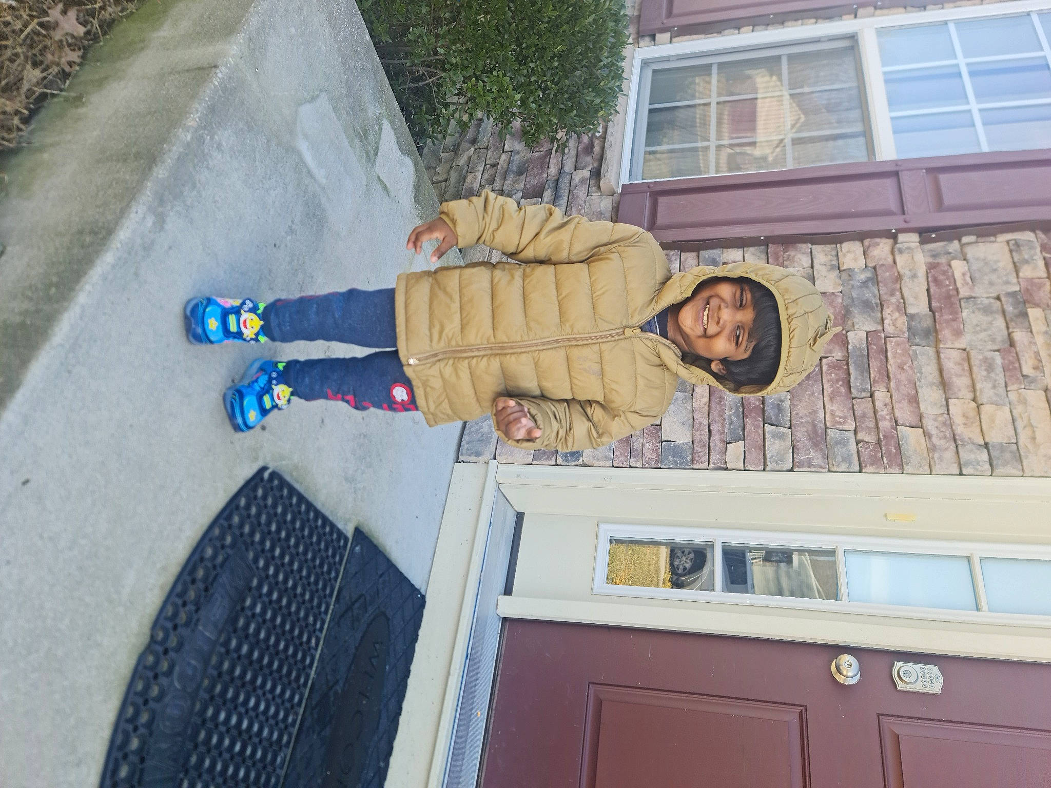 Binev is registered to the contest to win money with this photo: building, cabinetry, countertop, design, drawer, facade, hardwood, headwear, house, human_leg, joy, kitchen, person, plant, road_surface, roof, siding, sneakers, tree, walking_shoe