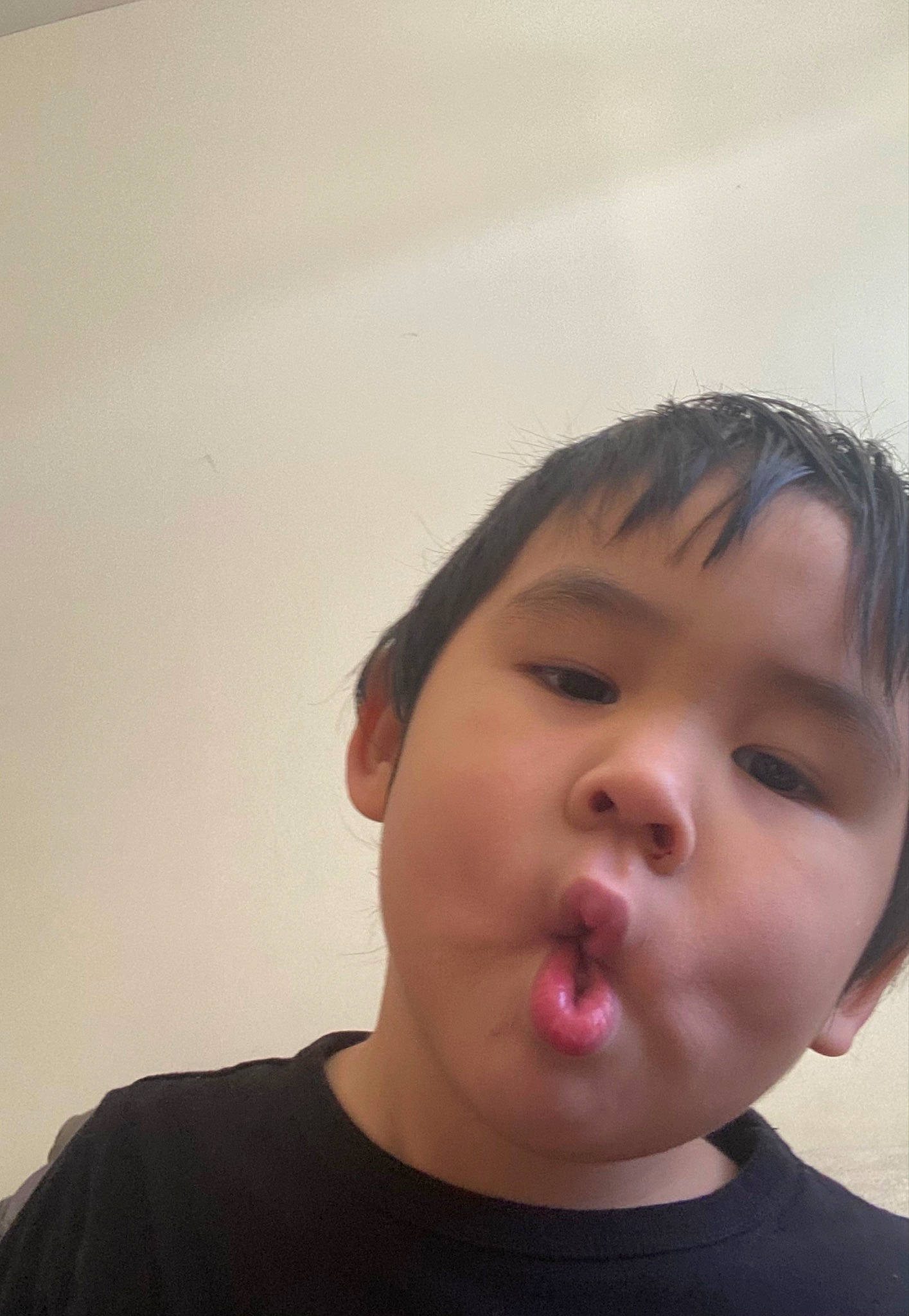 Matthew is registered to the contest to win money with this photo: cheek, chin, ear, eye, eyebrow, eyelash, flash_photography, forehead, gesture, happy, iris, jaw, lip, mouth, neck, nose, person, shoulder, t_shirt, toddler