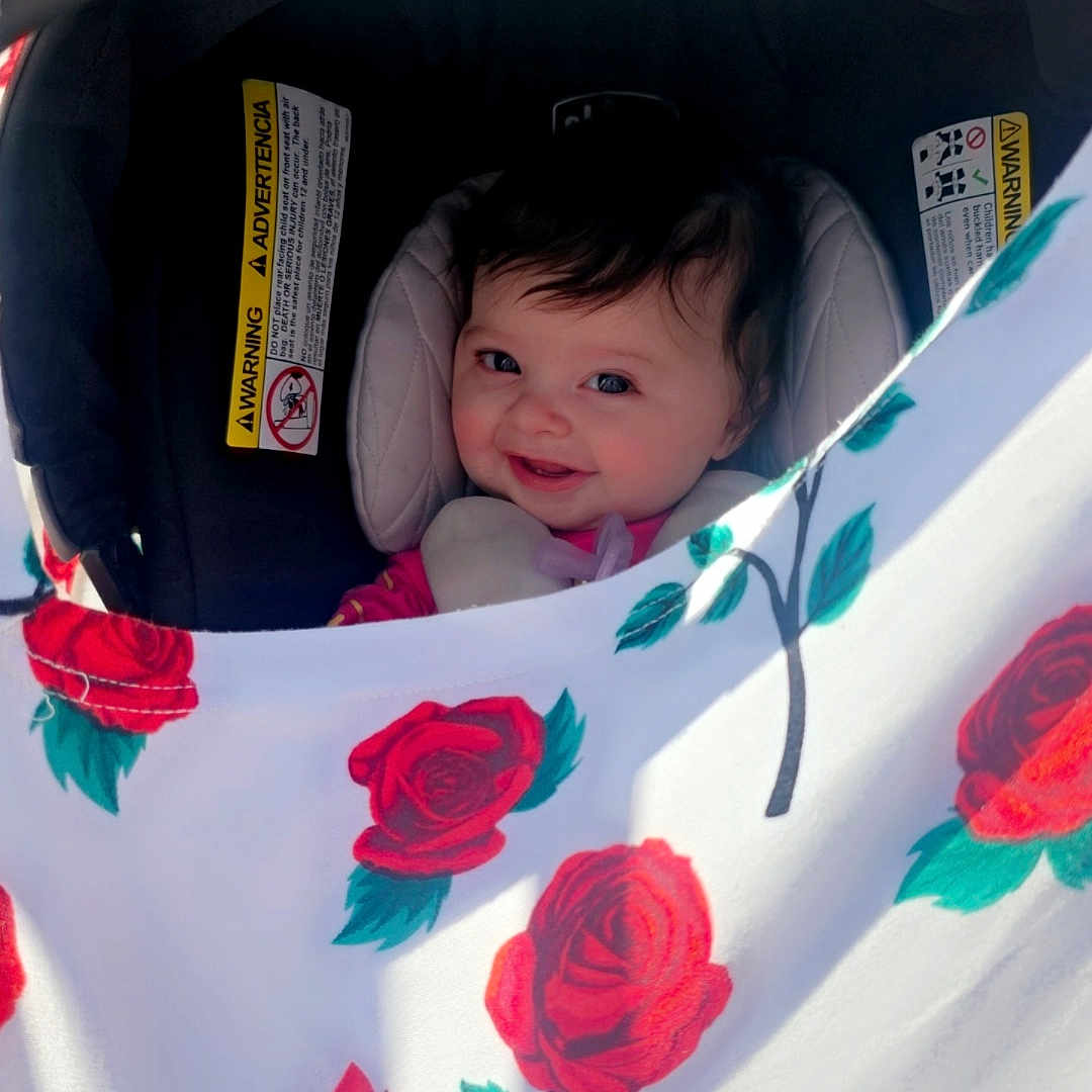 Journei Aliviah is registered to the contest to win money with this photo: architecture, baby, bed, building, crib, cushion, face, flower, furniture, head, homedecor, outdoors, person, petal, photography, plant, portrait, rose, shelter, stroller