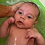 Andréa participe au concours pour gagner de l'argent avec cette photo : baby, bath, water, tub, child, hand, skin, infant, support, cute, expression, eyes, mouth, wet, parent, soothing, care, young, closeup, relaxation