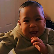 Lilo is registered to the contest to win money with this photo: baby, child, hoodie, smiling, laughing, indoor, person, cute, happy, face, hand, infant, young, warm, cozy, portrait, expression, toddler, clothing, blurred_background