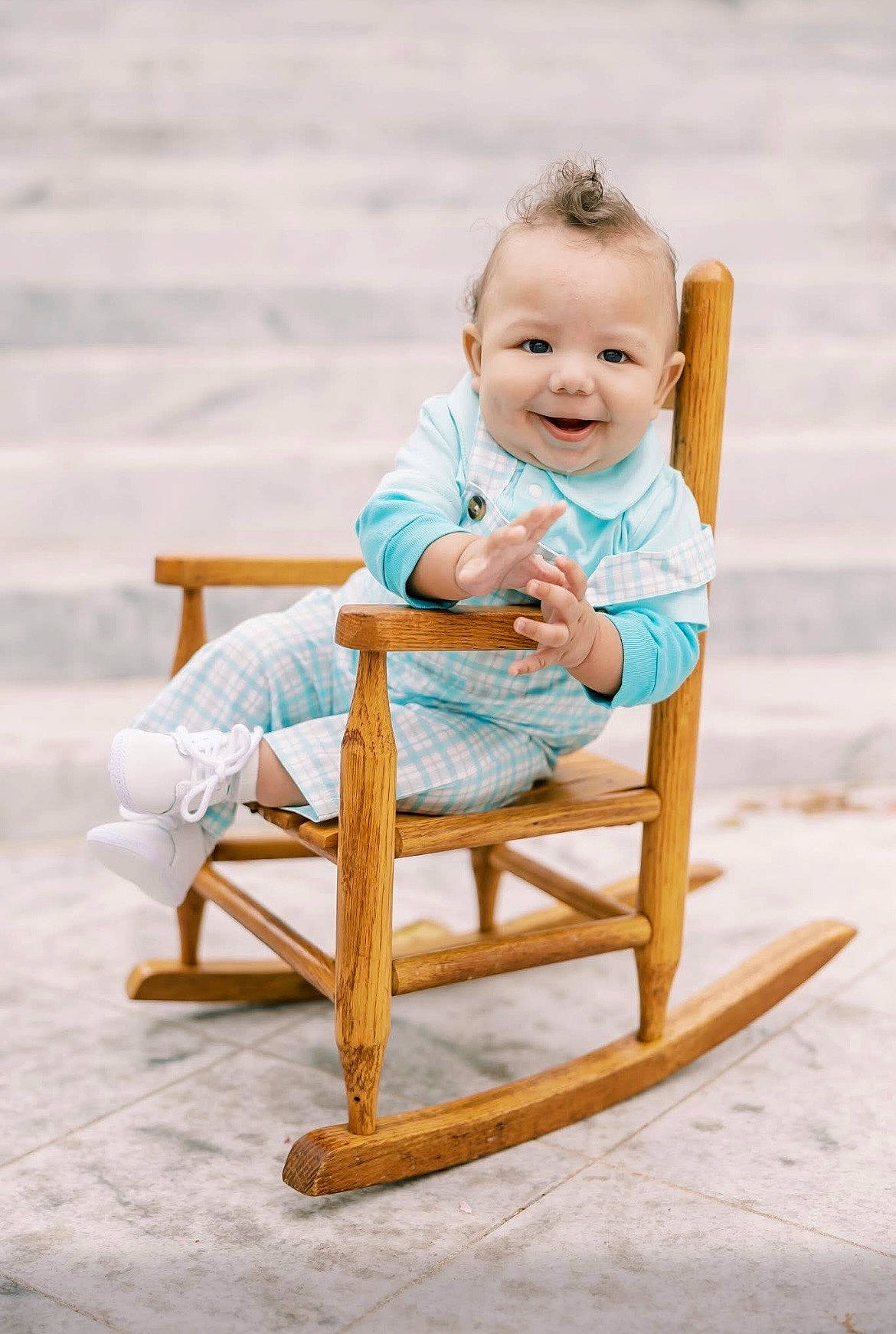 Dario joined the competition — help win amazing prizes! baby, blue_outfit, child, cute, hairstyle, hand_gesture, happy, infant, outdoor, person, plaid_clothing, playful, portrait, rocking, rocking_chair, sitting, smile, steps, white_shoes, wooden_chair