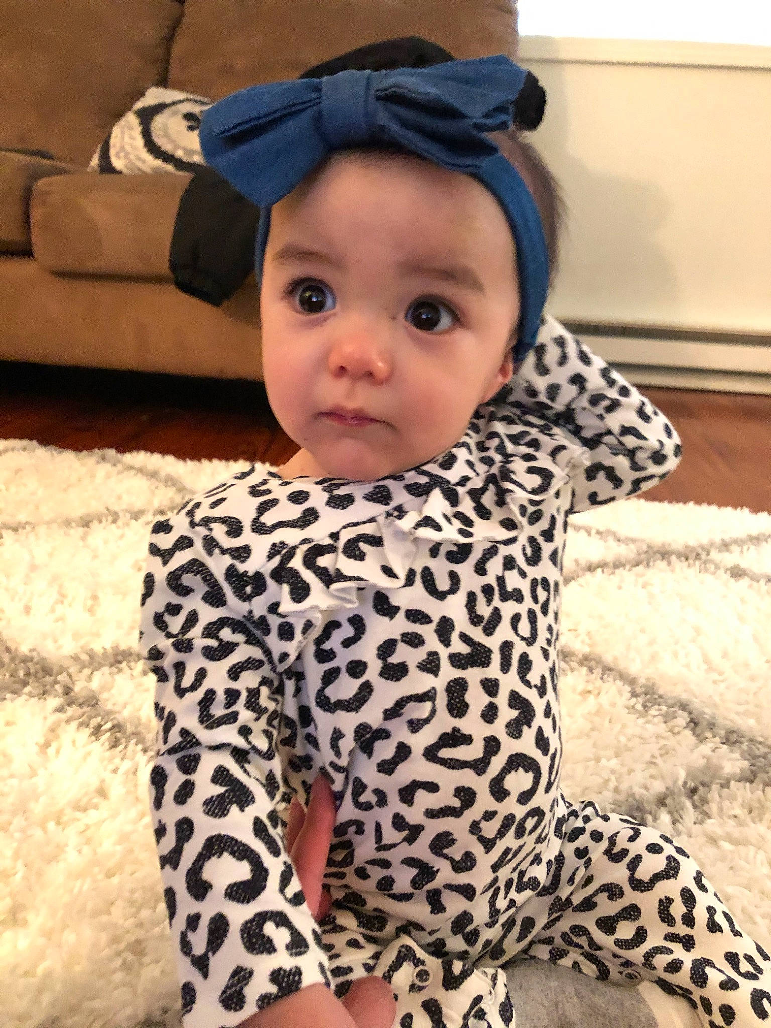 Iyla is registered to the contest to win money with this photo: baby, baby_products, baby_toddler_clothing, child, ear, fawn, head, pattern, person, product, skin, sleeve, toddler