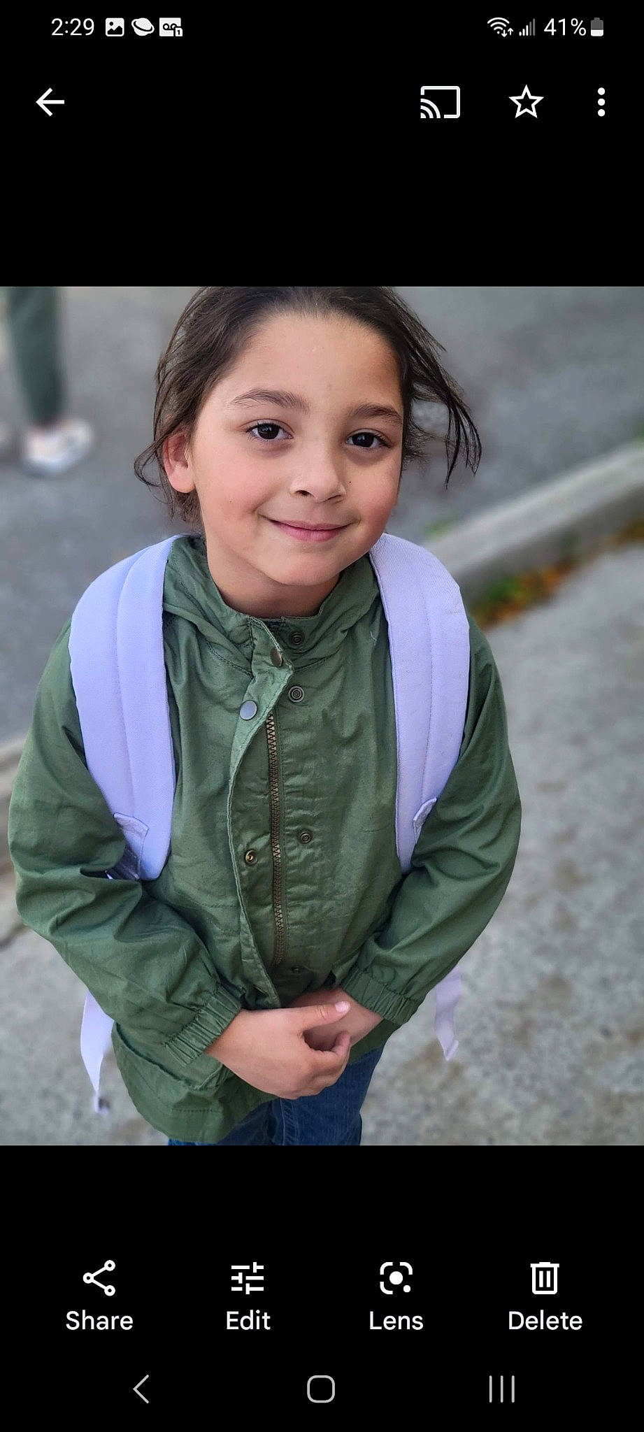 Izzy joined the competition — help win amazing prizes! cheek, child, chin, electric_blue, eye, face, flash_photography, fun, grass, happy, head, iris, joy, lip, neck, person, portrait_photography, sitting, skin, sleeve