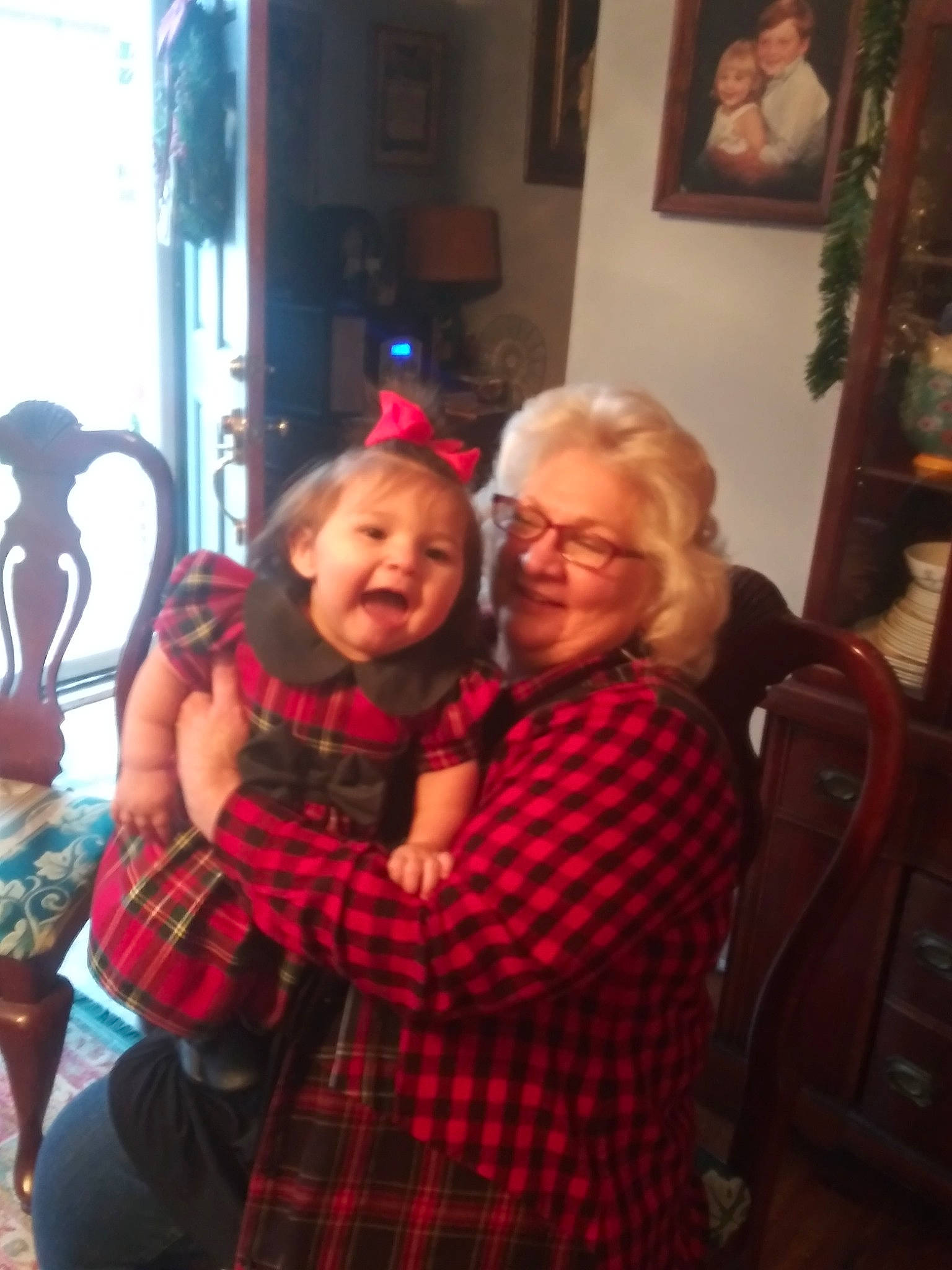 Triniti Sno is registered to the contest to win money with this photo: child, christmas, christmas_eve, design, event, family, fun, glasses, grandparent, holiday, pattern, people, person, photography, plaid, selfie, smile, tartan, textile, toddler