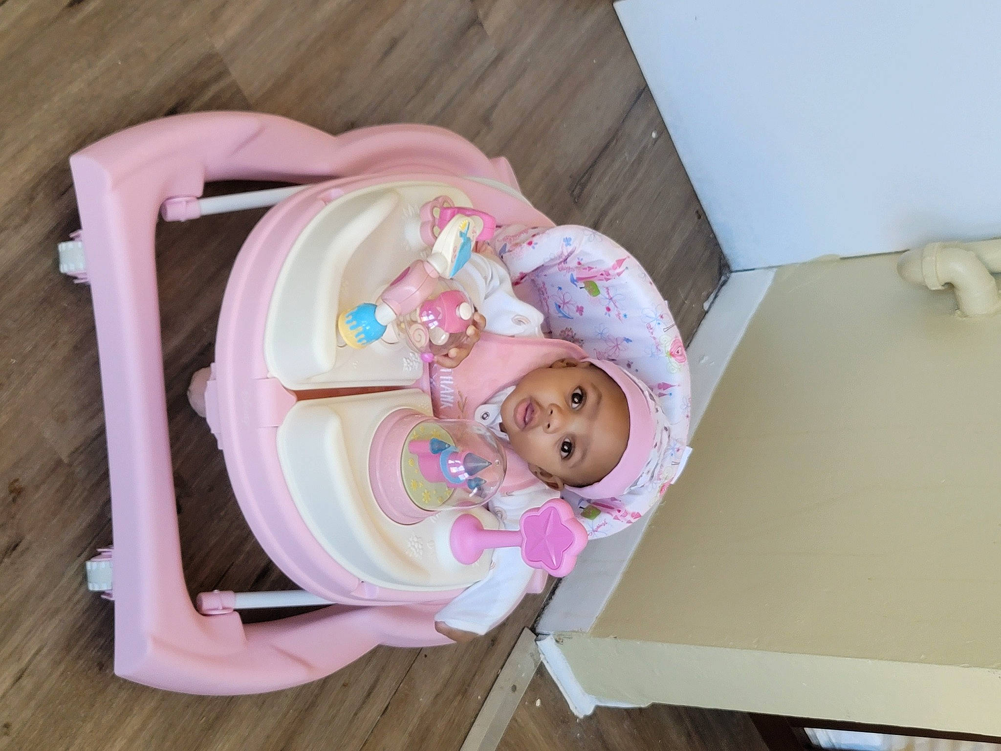 Miah is registered to the contest to win money with this photo: baby, baby_products, baby_safety, baby_toddler_clothing, baby_toys, child, comfort, embellishment, hardwood, headwear, linens, magenta, person, pink, room, toddler, wood