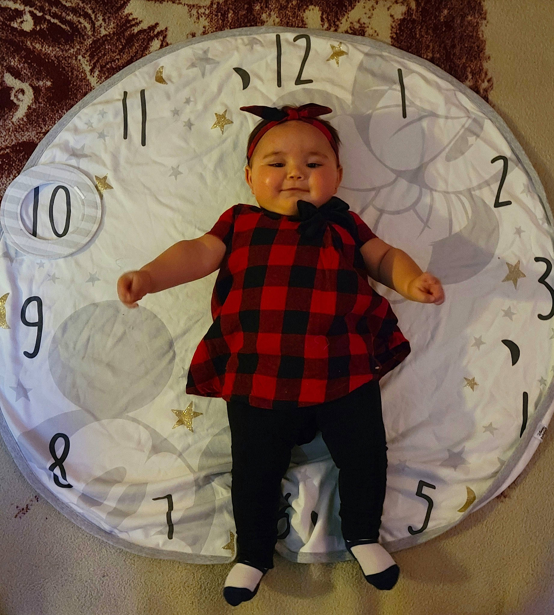 Arielle joined the competition — help win amazing prizes! baby_toddler_clothing, child, christmas, christmas_ornament, circle, design, eye, fun, happy, head, organ, ornament, pattern, person, plaid, room, sleeve, smile, tartan, textile