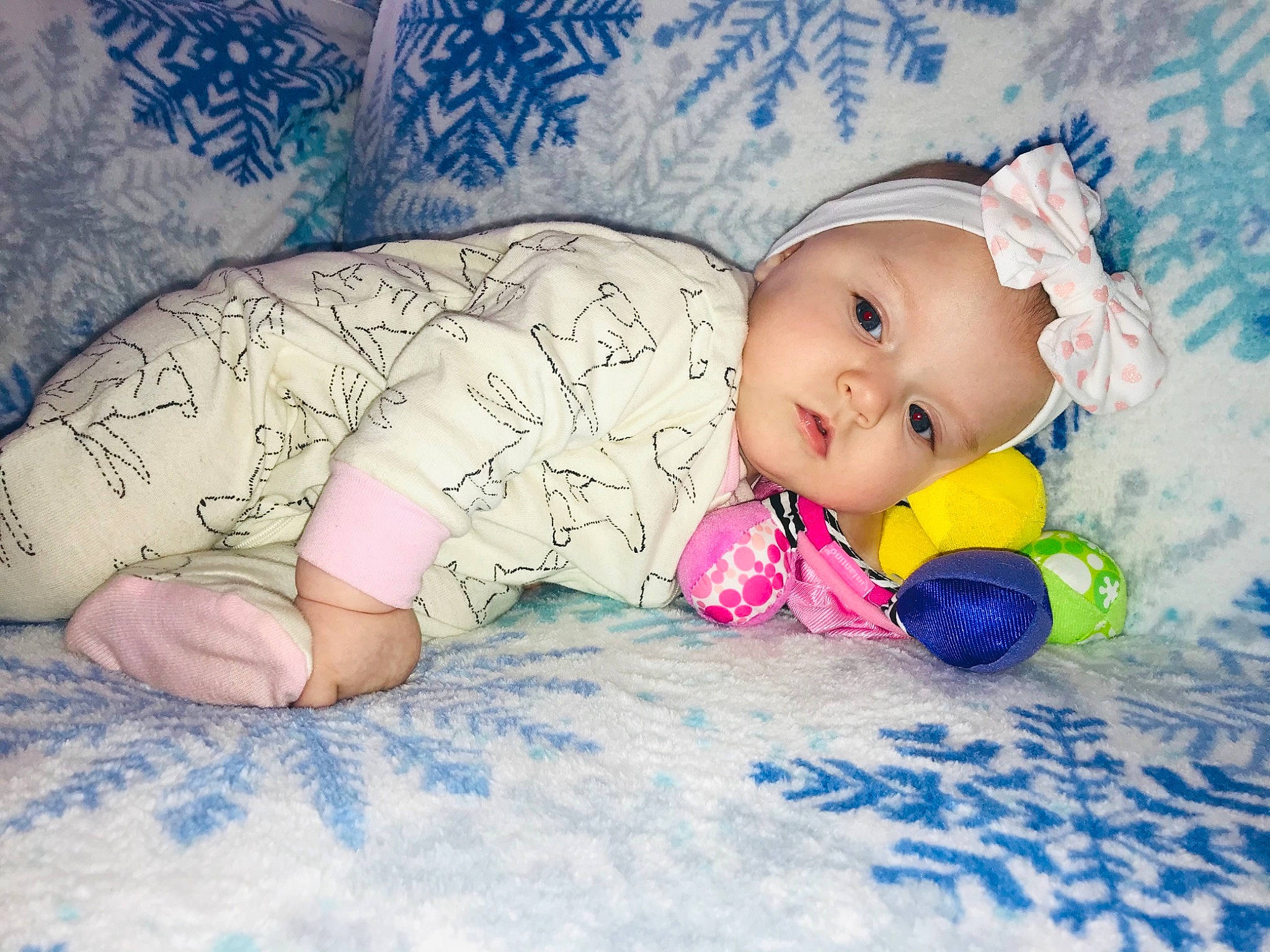 Riverleigh is registered to the contest to win money with this photo: baby, baby_products, baby_sleeping, baby_toddler_clothing, blue, cheek, child, comfort, doll, eye, facial_expression, finger, hand, happy, headgear, headwear, iris, linens, pattern, person