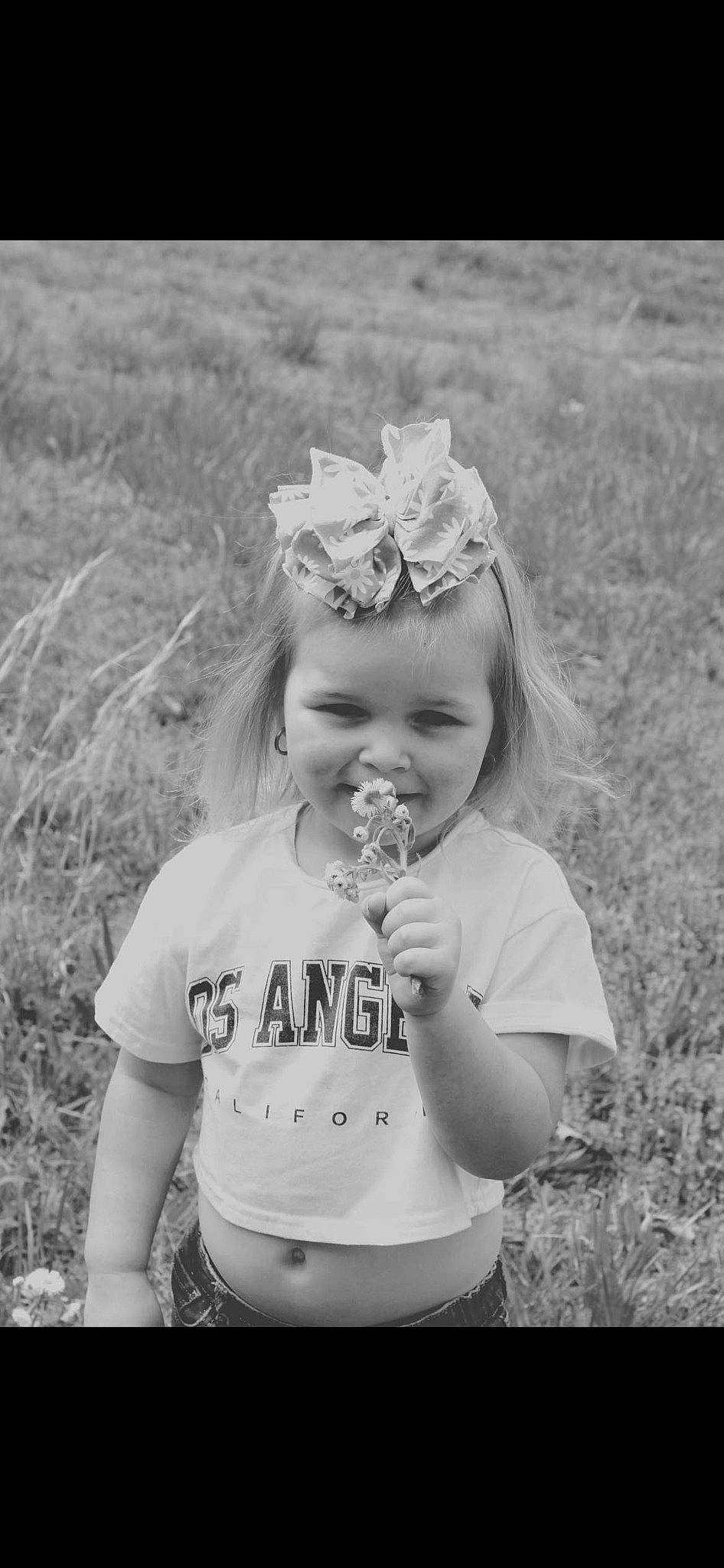 Serenity is registered to the contest to win money with this photo: black, black_and_white, clothing, eye, flash_photography, grass, happy, head, iris, joy, monochrome, people, people_in_nature, person, photograph, plant, skin, smile, standing, style