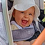 baby, baby_clothing, baby_seat, child, closeup, cute, daylight, expressive, face, happy, hat, infant, joy, outdoor, person, portrait, seatbelt, smiling, stroller, sunhat