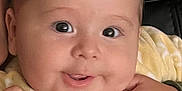 Theodore joined the competition — help win amazing prizes! baby, child, face, eyes, smile, hand, blanket, yellow, soft, cute, infant, closeup, adorable, skin, expression, warm, comfort, person, portrait, young