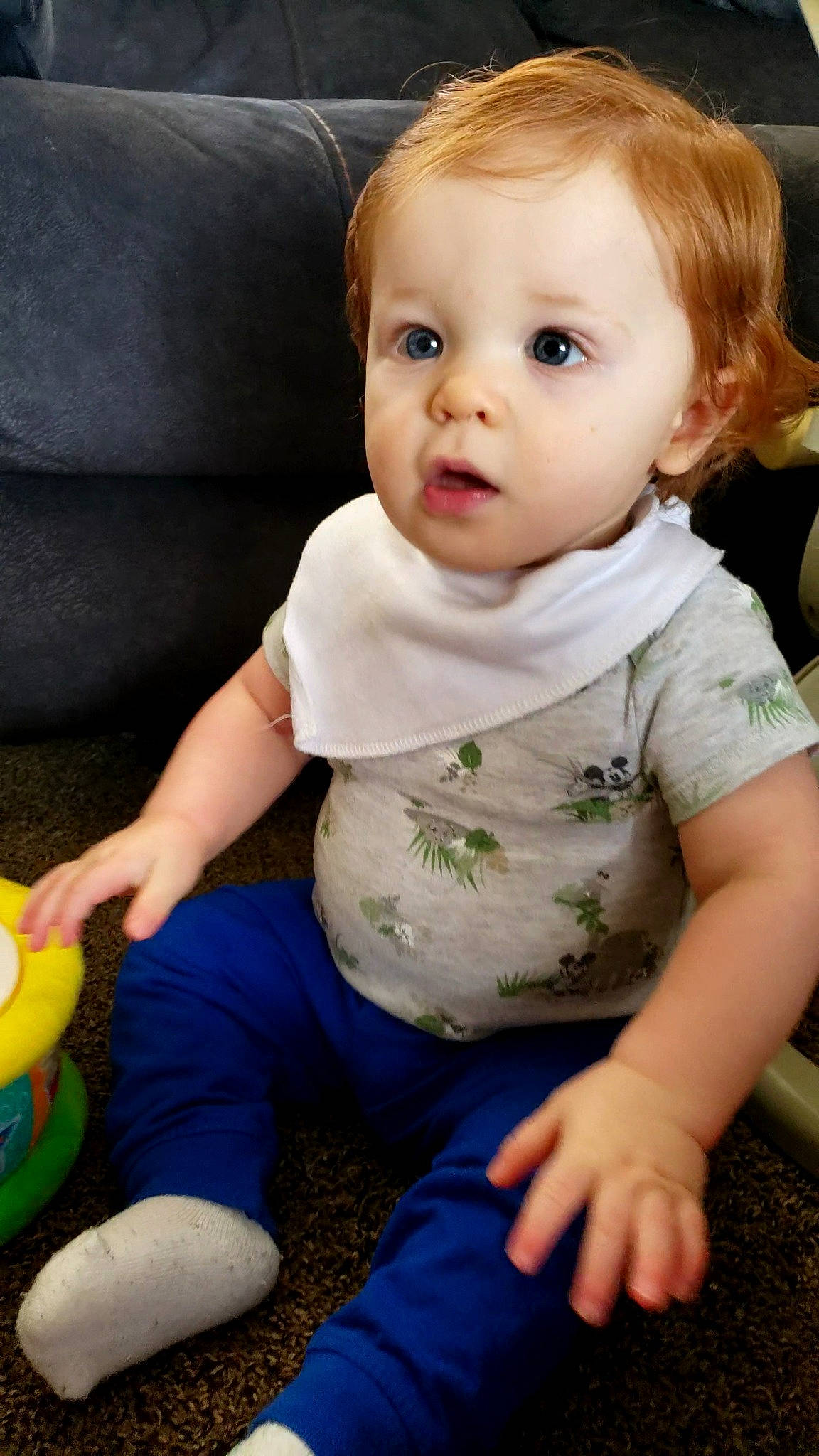 Sonny is registered to the contest to win money with this photo: baby, baby_toddler_clothing, cheek, child, dress, flooring, fun, grass, happy, iris, nose, pattern, person, portrait_photography, sitting, skin, sleeve, surprise, t_shirt, toddler