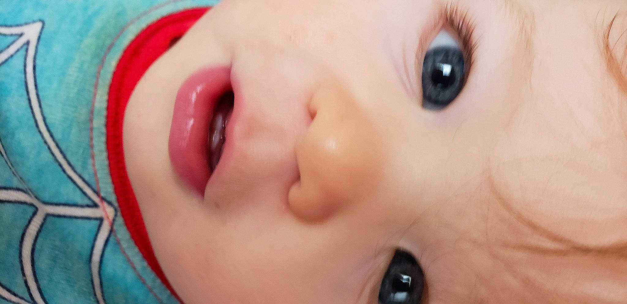 Sonny is registered to the contest to win money with this photo: baby, cheek, child, close_up, ear, eye, eyebrow, eyelash, happy, iris, lip, mouth, nail, no_expression, nose, organ, person, portrait_photography, skin, smile