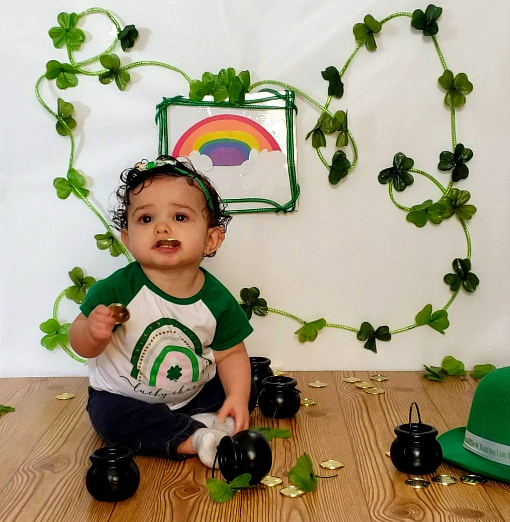 Harper joined the competition — help win amazing prizes! baby, baby_toddler_clothing, camera, child, flooring, flowerpot, grass, green, happy, houseplant, luggage_and_bags, person, plant, play, product, room, single_lens_reflex_camera, sleeve, t_shirt, toddler