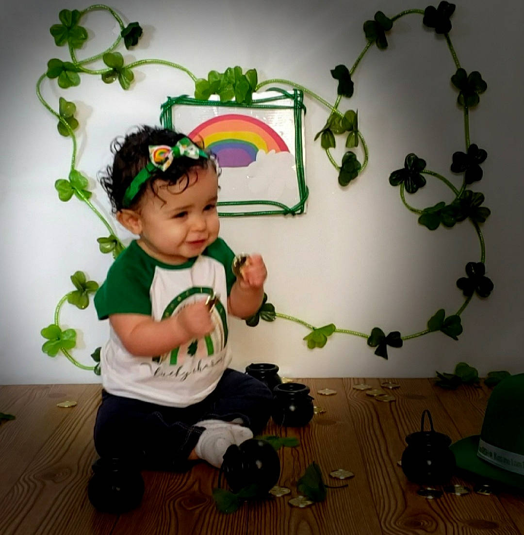 Harper is registered to the contest to win money with this photo: baby, baby_toddler_clothing, bag, child, flooring, floral_design, flowerpot, fun, grass, green, happy, houseplant, luggage_and_bags, person, plant, room, toddler, toy, tree, wall_sticker