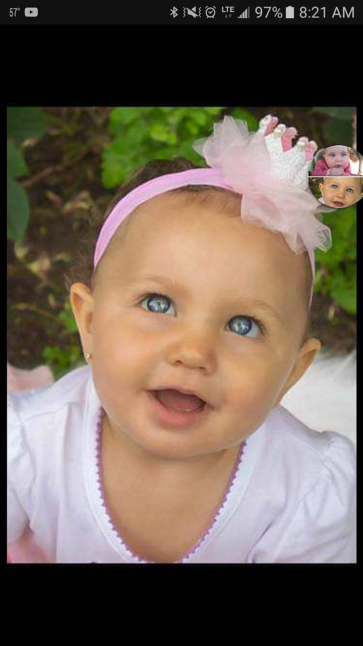 Rosalia is registered to the contest to win money with this photo: baby, cheek, child, eye, eyebrow, face, facial_expression, forehead, hair_accessory, head, headband, headgear, headpiece, headwear, lip, nose, person, photography, pink, skin