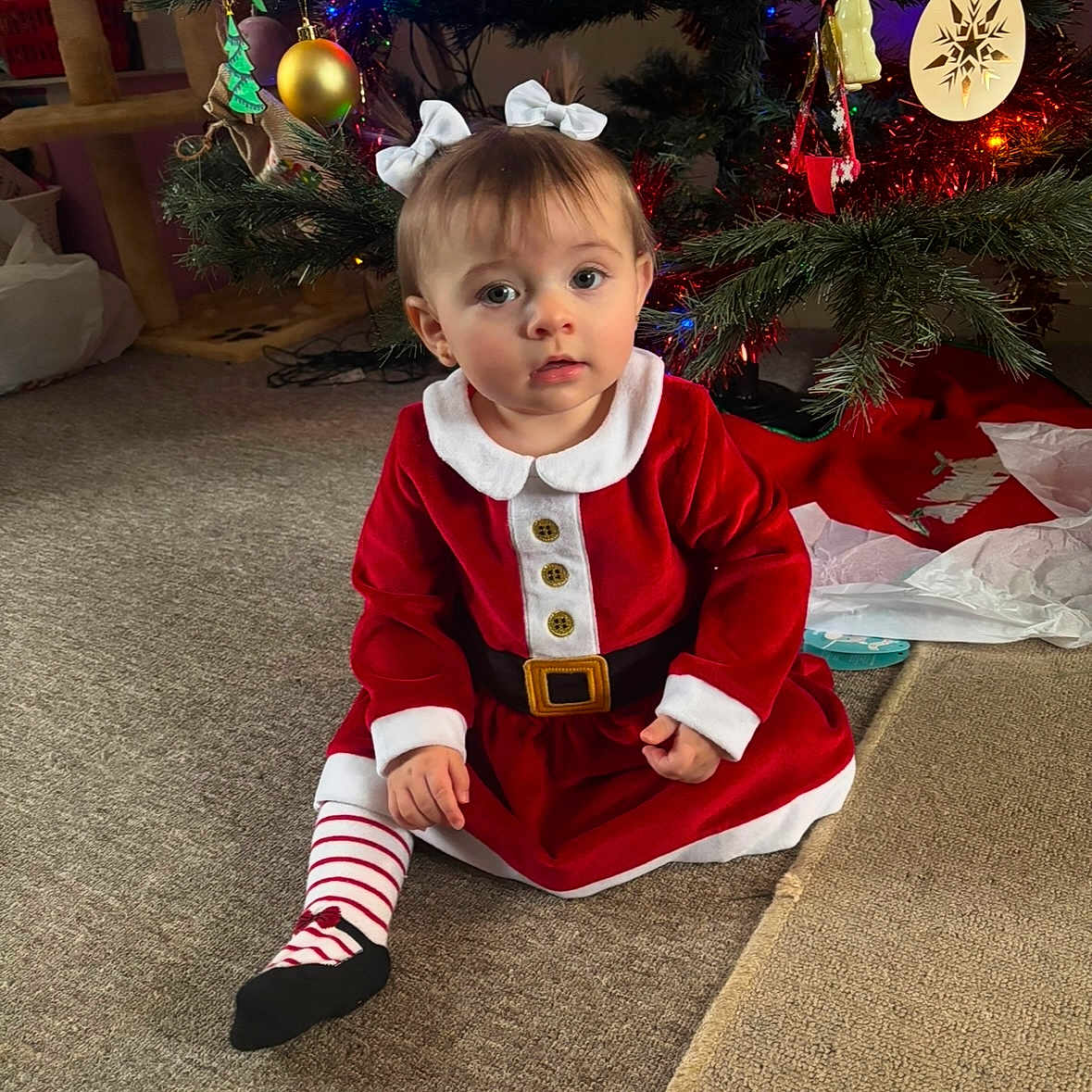Arla is registered to the contest to win money with this photo: accessories, baby, balloon, christmas, christmasdecorations, clothing, costume, face, festival, fir, head, lighting, person, photography, plant, portrait, pottedplant, sitting, tree, wood