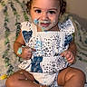Estelle joined the competition — help win amazing prizes! toddler, child, cake, frosting, messy, cute, smiling, sitting, pigtails, hair_bows, face, hands, legs, feet, clothing, blanket, indoor, portrait, happy, celebration