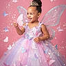 child, girl, princess, fairy, dress, butterfly, tiara, glitter, sparkle, magic, pink_background, smile, happy, costume, wings, tulle, sparkles, portrait, cute, fantasy