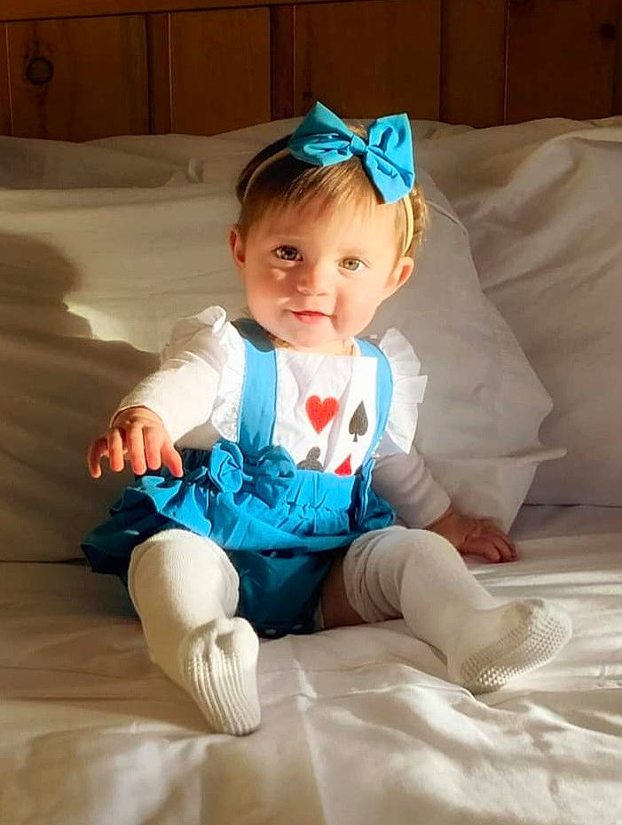 Ariah joined the competition — help win amazing prizes! baby, baby_toddler_clothing, cabinetry, child, comfort, fashion_accessory, foot, fun, happy, headpiece, human_leg, leg, linens, person, sitting, skin, sleeve, smile, sock, t_shirt