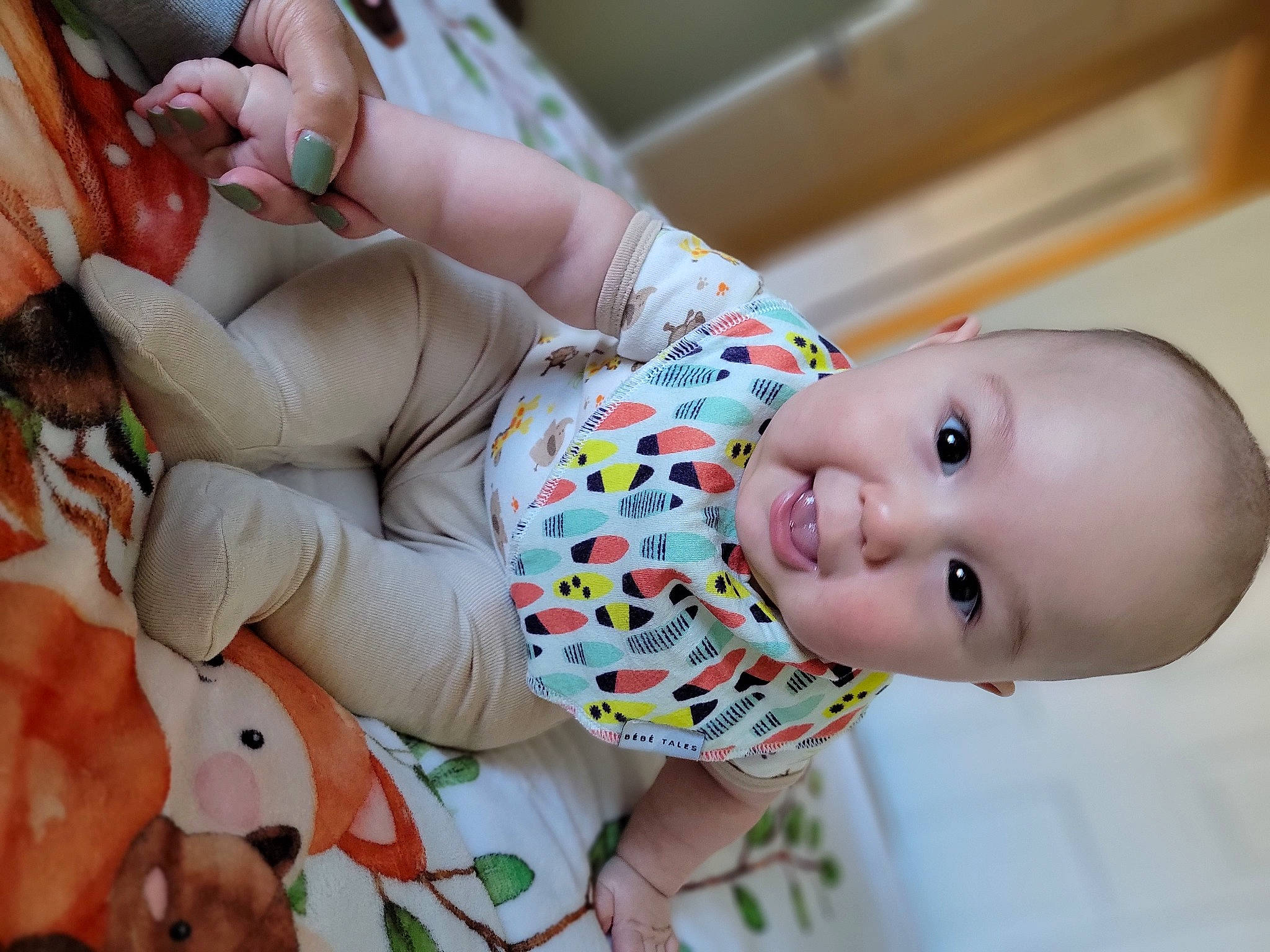 Charlie is registered to the contest to win money with this photo: baby, baby_toddler_clothing, cheek, child, face, facial_expression, finger, happy, health_care, human, mammal, medical_procedure, mouth, nose, people, person, product, skin, textile, thumb