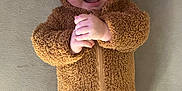 Archie joined the competition — help win amazing prizes! baby, infant, smiling, bear_costume, fuzzy_clothing, cute, hands_clasped, lying_down, soft_surface, happy, child, portrait, one_person, indoors, warm_clothing, baby_face, adorable, cozy, infant_clothing, expression