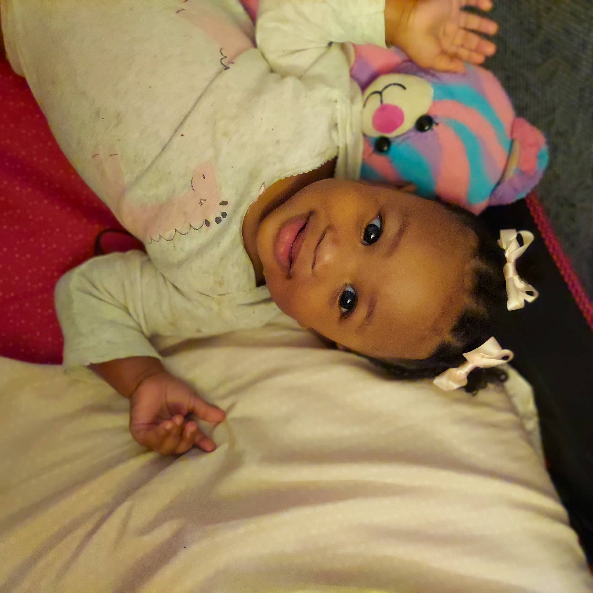 Kelani is registered to the contest to win money with this photo: arm, baby, baby_toddler_clothing, cheek, child, comfort, flooring, hair, happy, human_body, iris, joy, linens, lip, nose, person, skin, sleeve, smile, textile